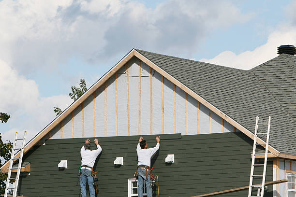 Professional Siding technician working in Medford, OR